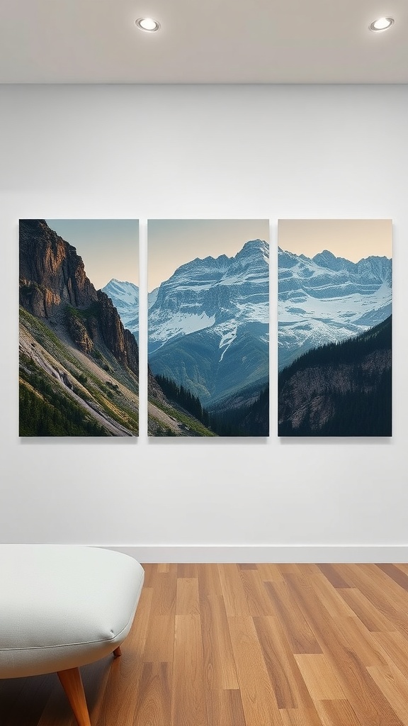 Three canvas prints of mountain landscapes on a white wall with a cozy chair in the foreground